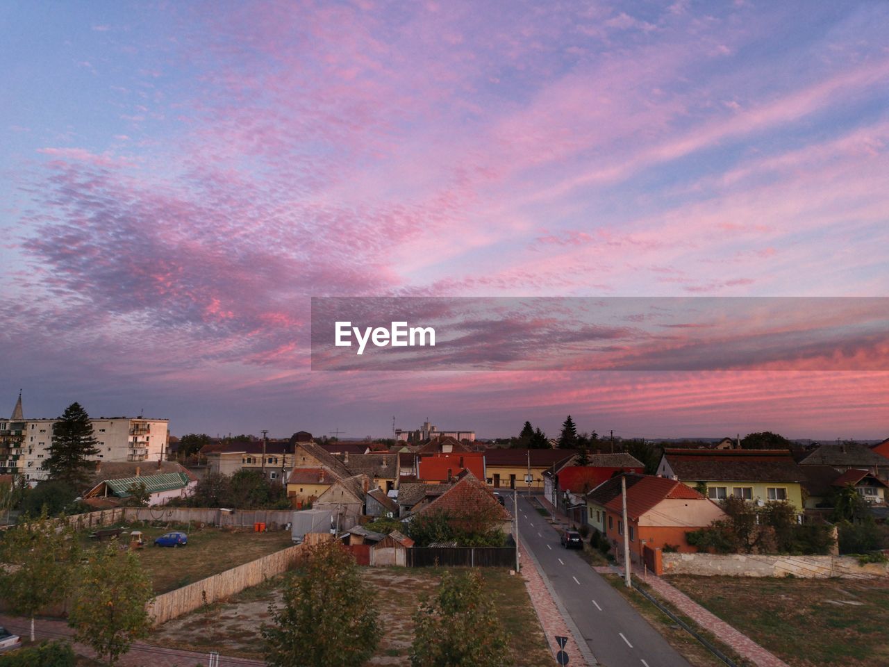 High angle view of street amidst buildings in town