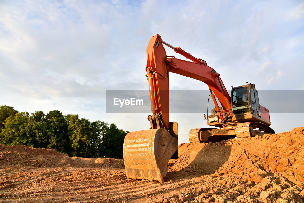 Excavator dig sand at the open-pit. heavy machinery working in the mining quarry. 