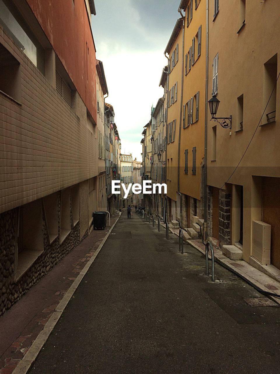 Street amidst buildings against sky