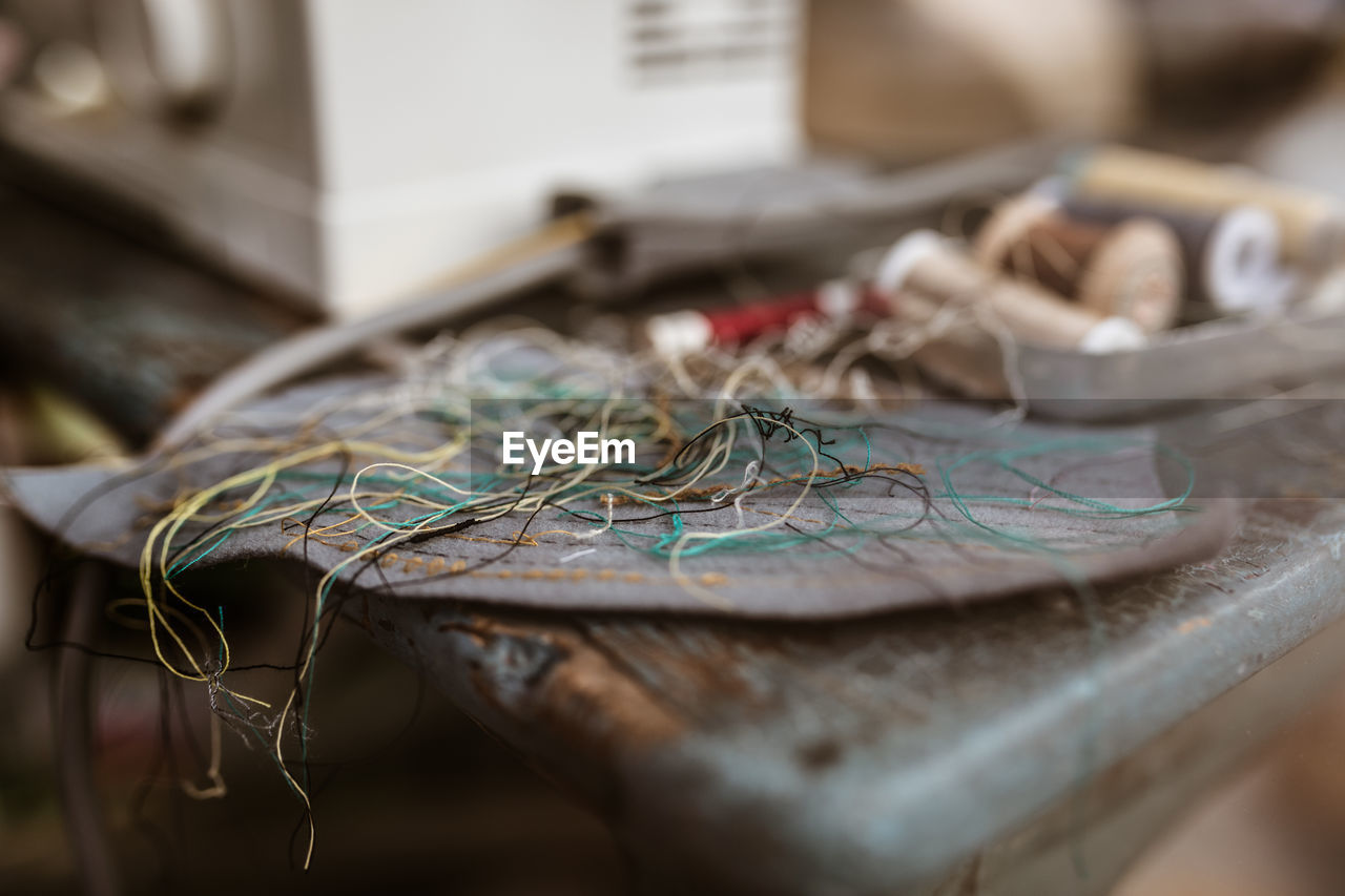 Close-up of thread on table