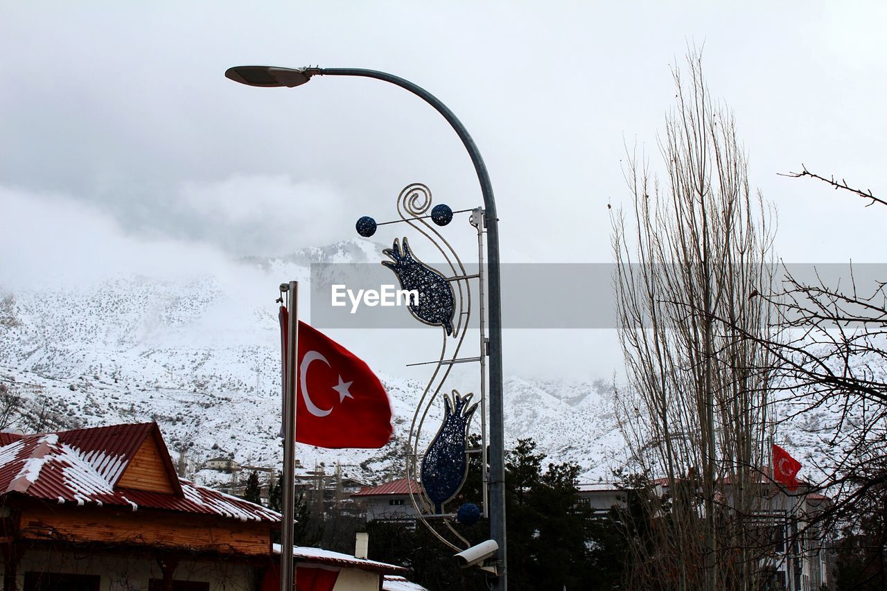 LOW ANGLE VIEW OF COMMUNICATIONS TOWER AGAINST SKY