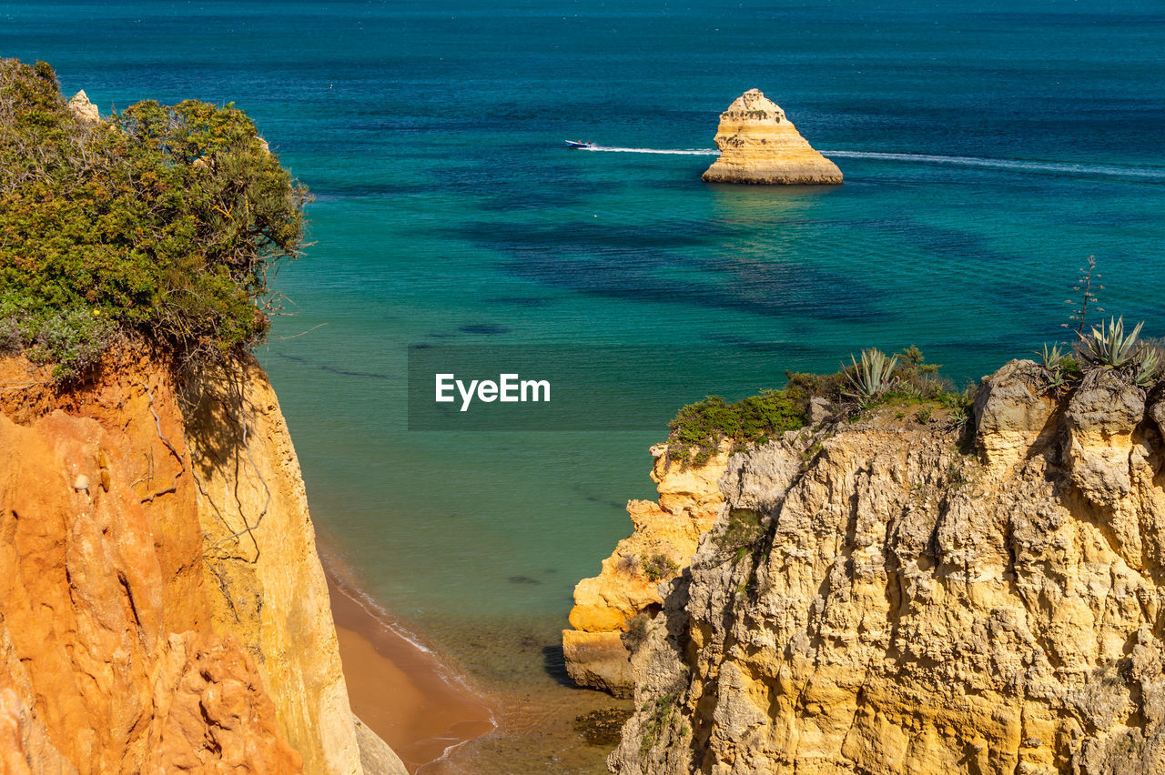 SCENIC VIEW OF SEA AND ROCK FORMATION