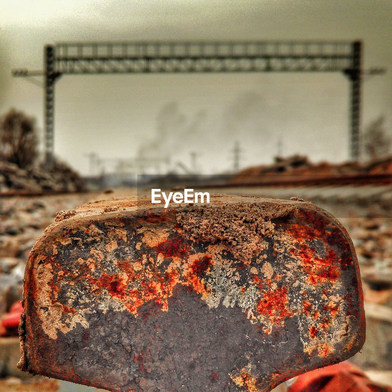 Close-up of rusty railroad track against sky