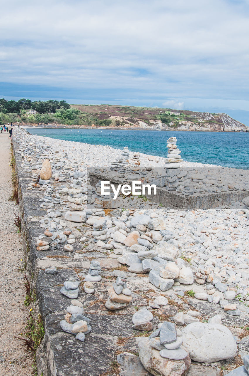 STONES BY SEA AGAINST SKY