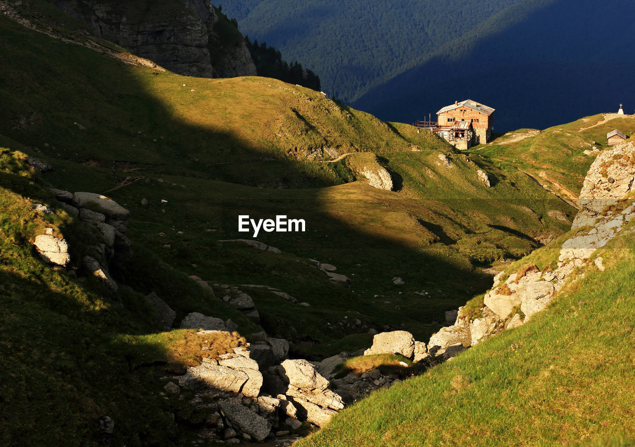 House on mountain at bucegi natural park during sunny day