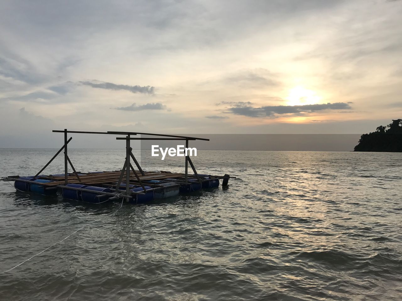 FISHING BOAT IN SEA AGAINST SKY