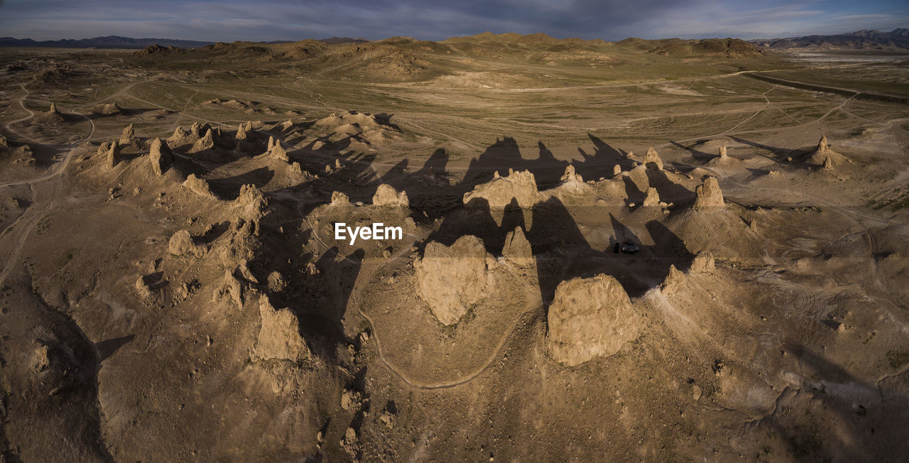 Trona pillars casting long shadows from above