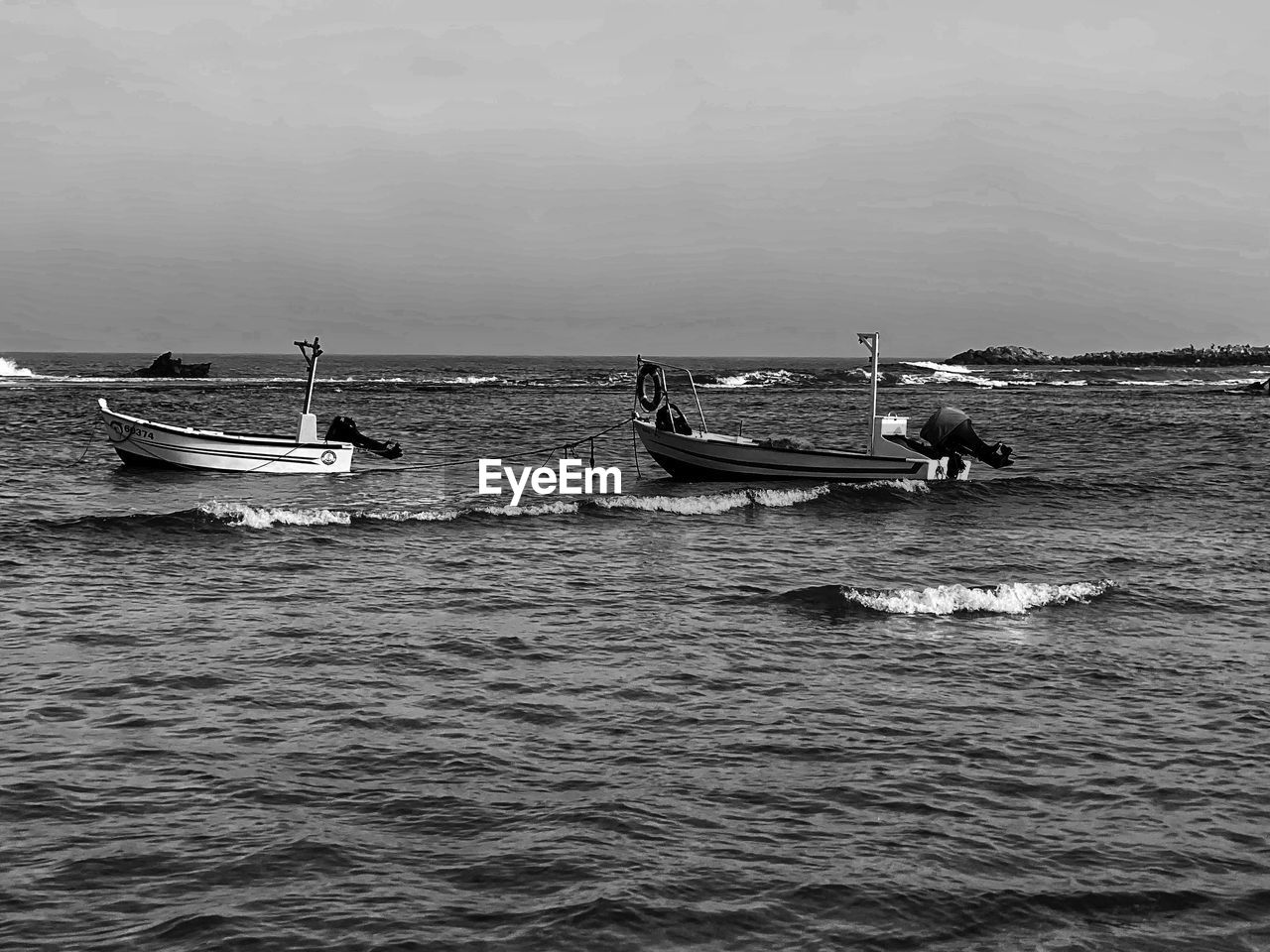 water, nautical vessel, transportation, sea, mode of transportation, black and white, monochrome photography, nature, monochrome, sky, boat, men, waterfront, vehicle, day, travel, group of people, scenics - nature, occupation, beauty in nature, outdoors, boating, watercraft, wave, coast, fisherman, ship, beach, tranquility, lifestyles, sailing, tranquil scene, horizon over water