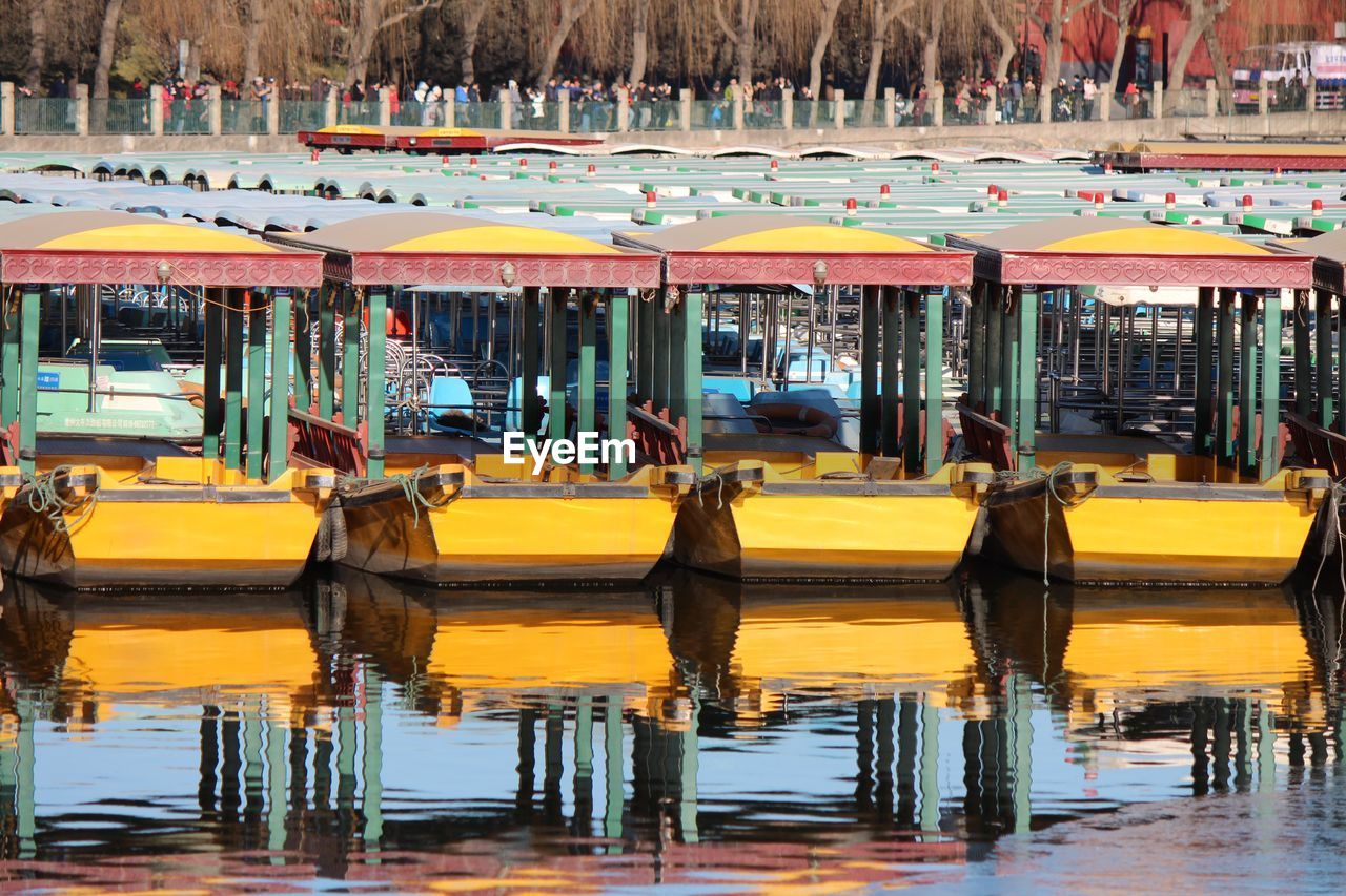 Boats moored on lake