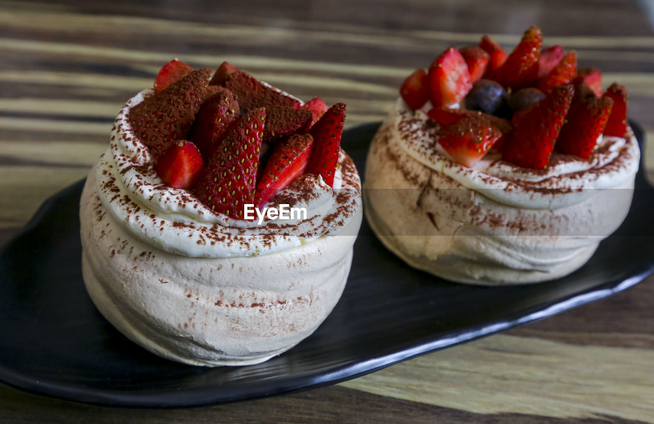 CLOSE-UP OF STRAWBERRY CAKE WITH ICE CREAM