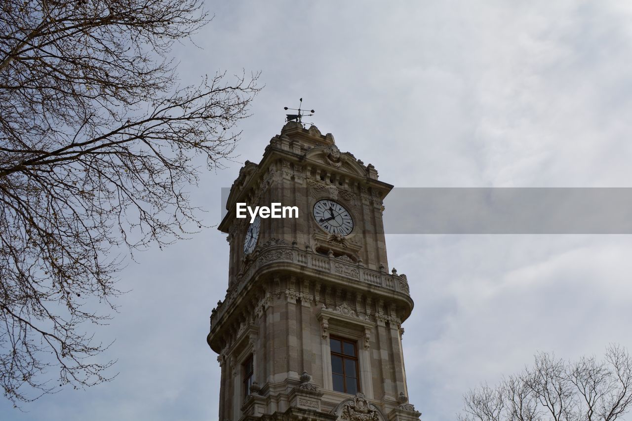 Low angle view of clock tower against sky