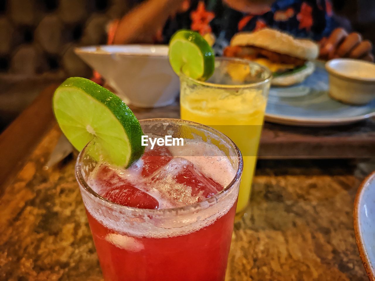 CLOSE-UP OF BEER WITH GLASS OF JUICE