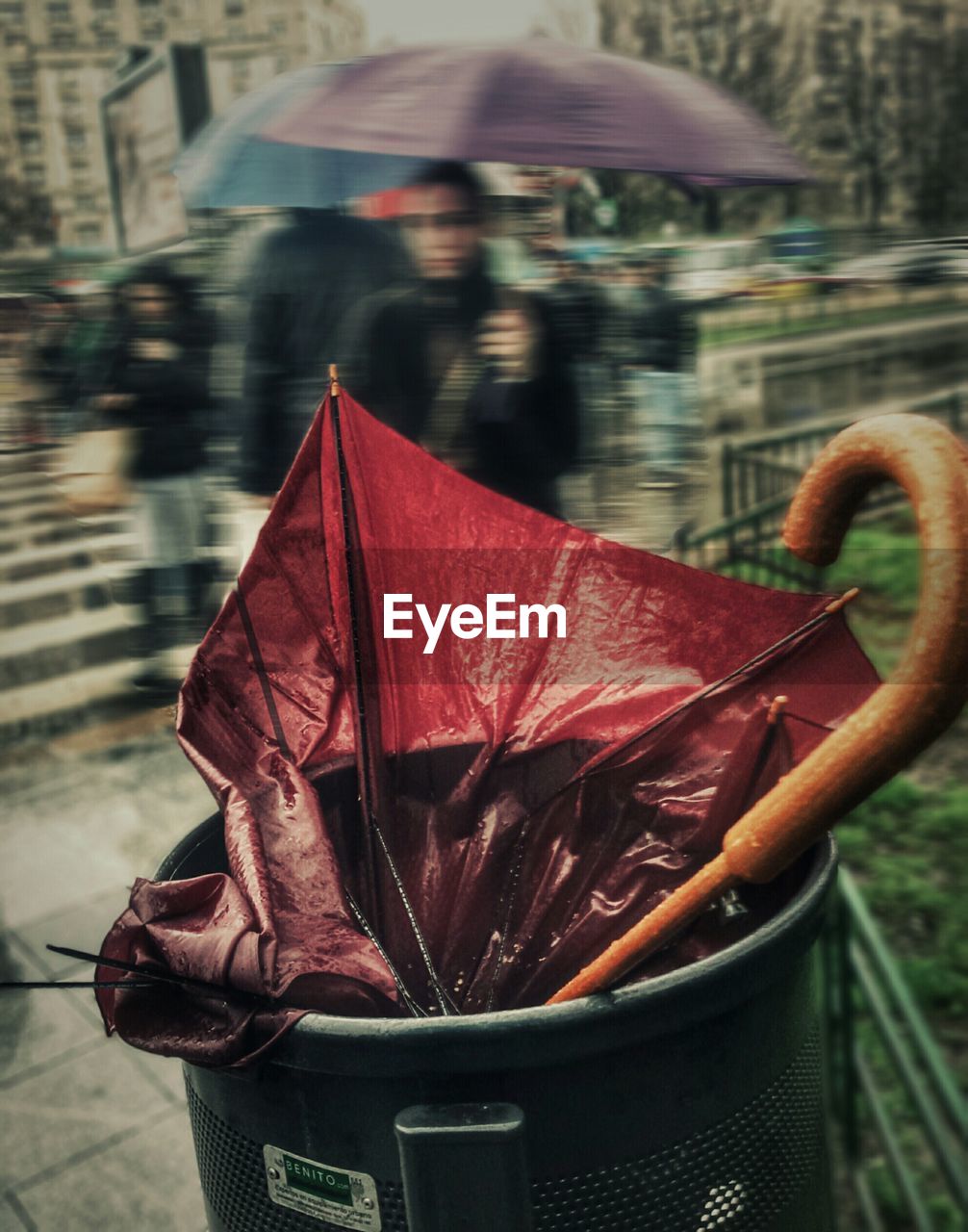 Close-up of umbrella in garbage can during monsoon