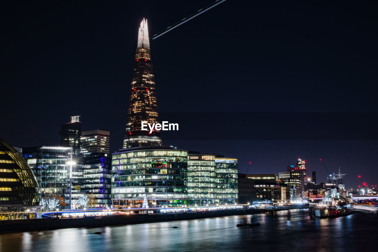 Illuminated buildings in city at night