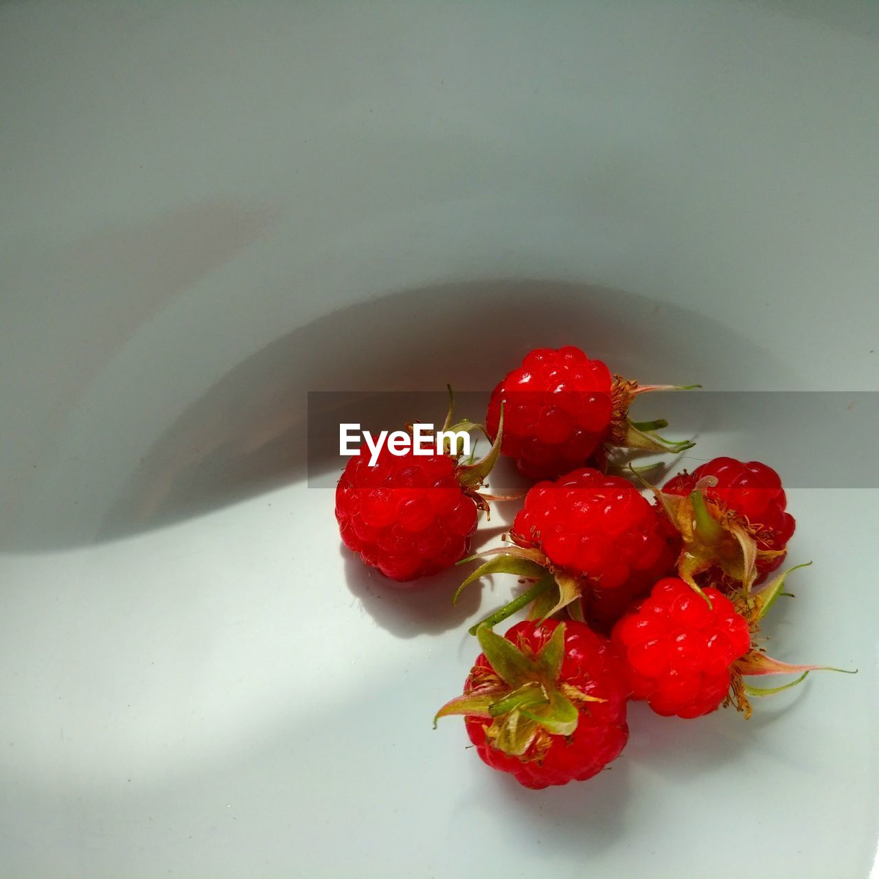 High angle view of raspberries in bowl