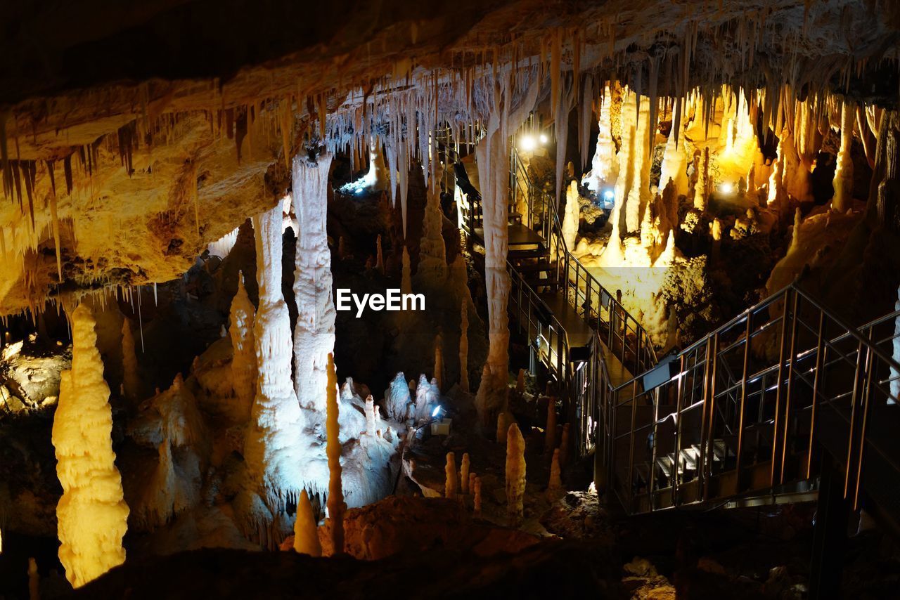 cave, stalactite, stalagmite, illuminated, rock, indoors, no people, geology, rock formation, nature, speleothem, physical geography, travel destinations, limestone, formation