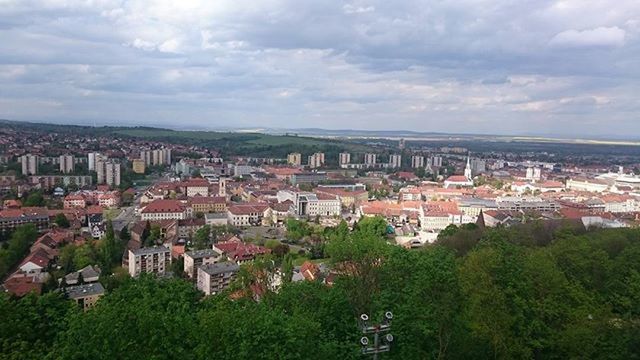 VIEW OF CITYSCAPE AGAINST CLOUDY SKY