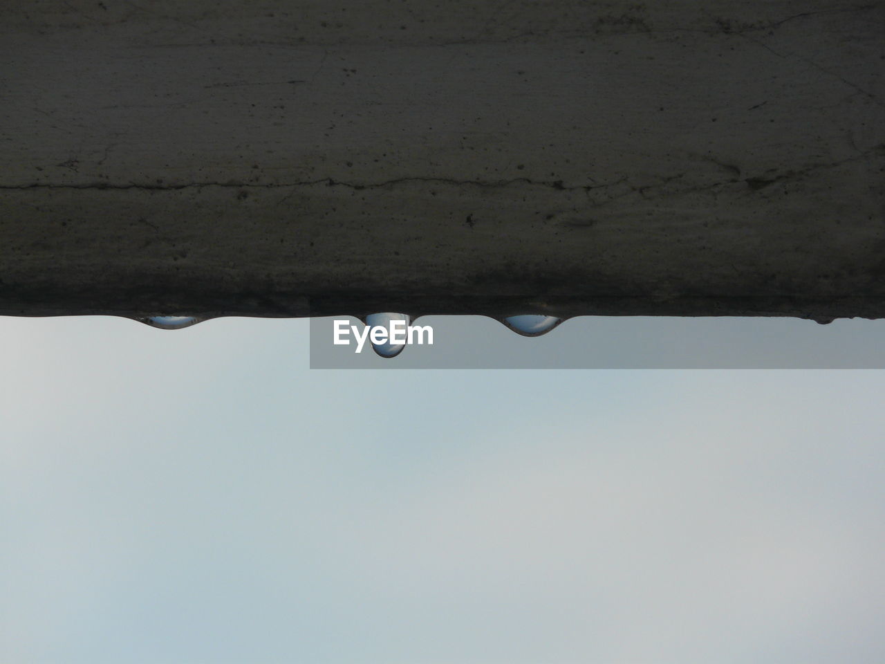 Close-up of raindrops on railing