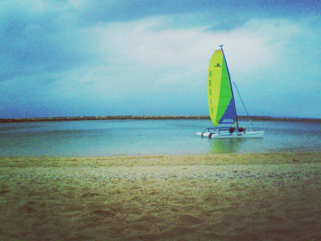 Boat sailing at beach