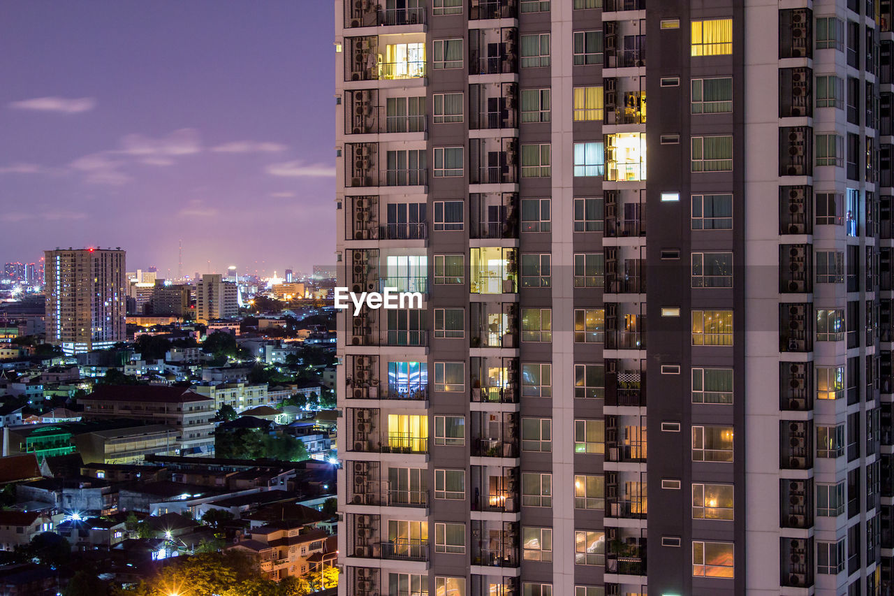 Illuminated buildings in city at night