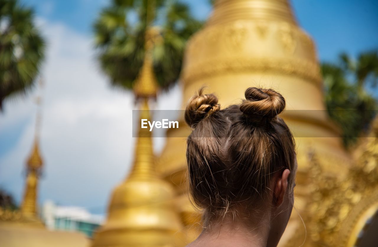 Rear view of woman outside temple