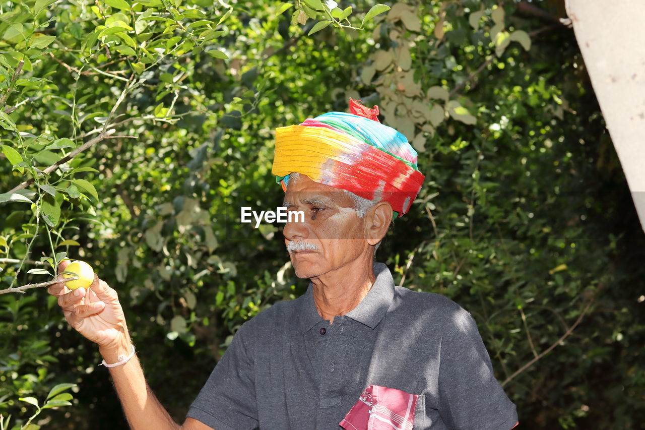 Close-up portrait of an indian senior farmer dressed according to rajasthani culture and tradition 