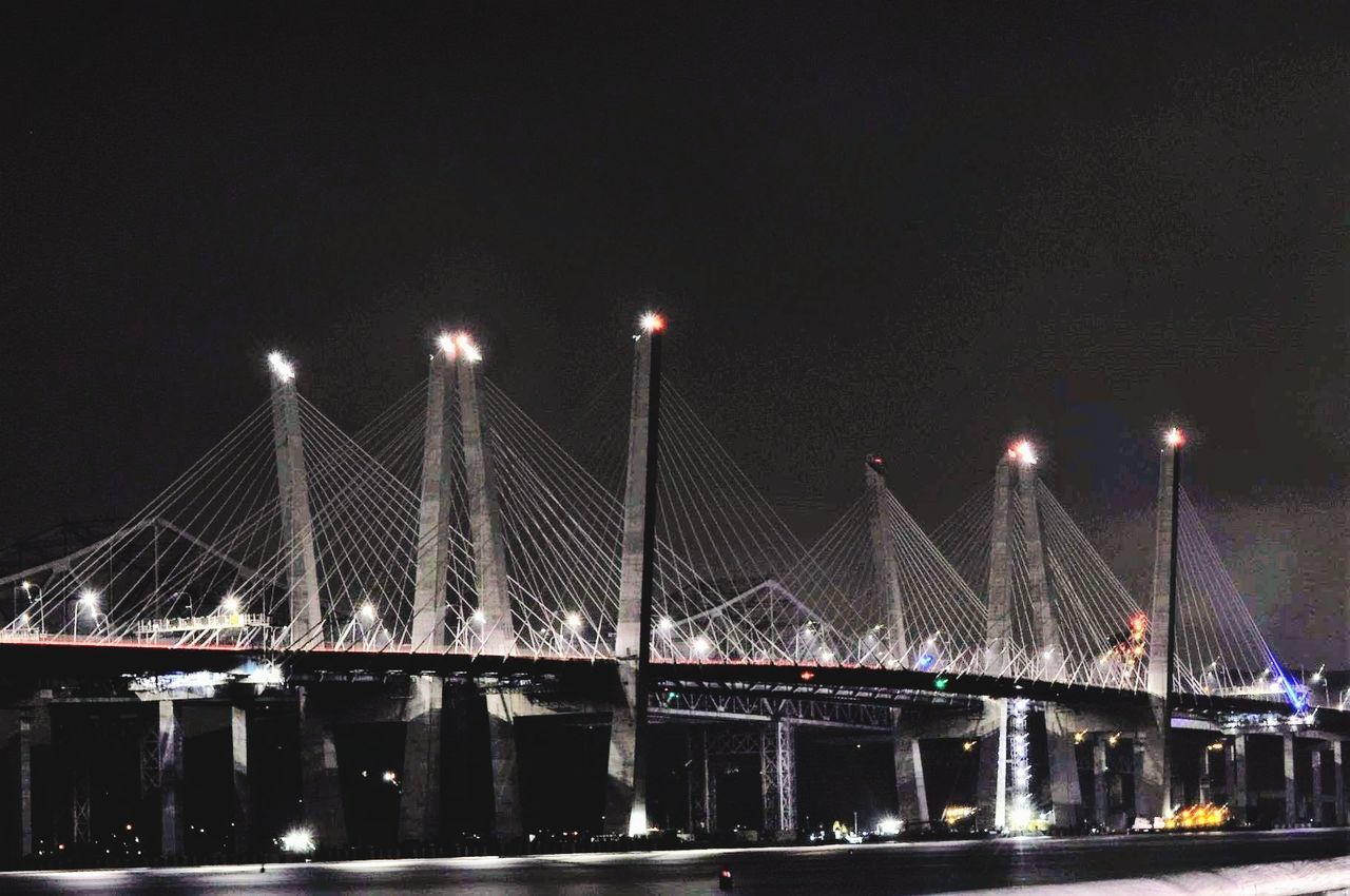 ILLUMINATED BRIDGE AT NIGHT