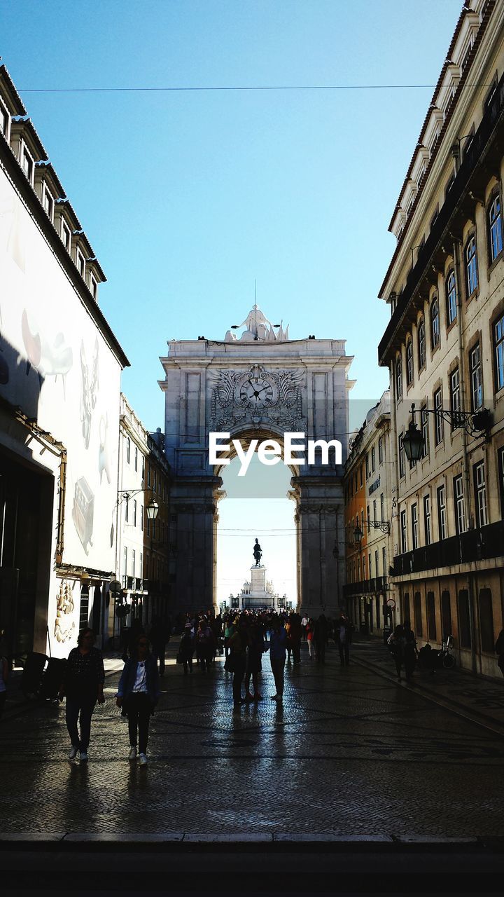 VIEW OF PEOPLE WALKING IN FRONT OF BUILDING