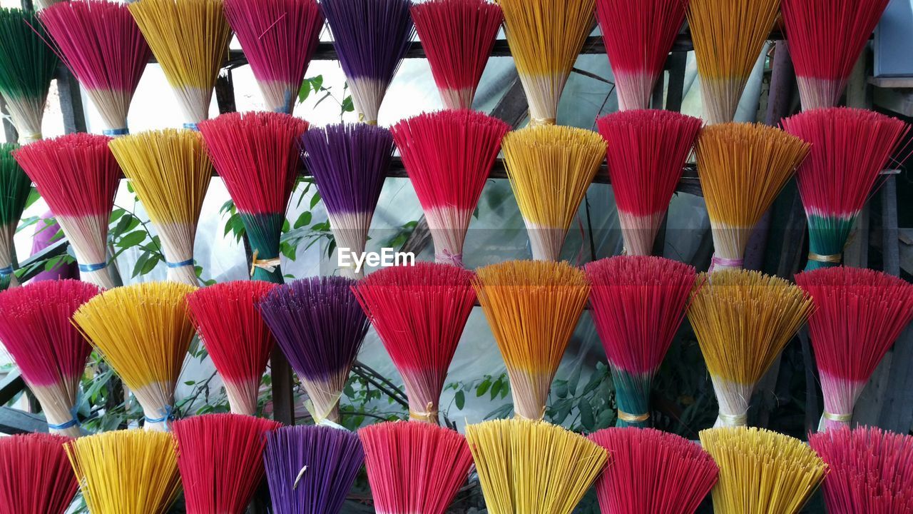 Colorful incense sticks arranged for sale