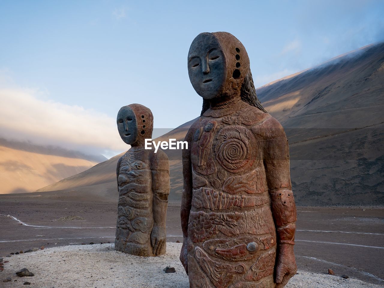 Sculpture of chinchorro mummy statue on land against sky