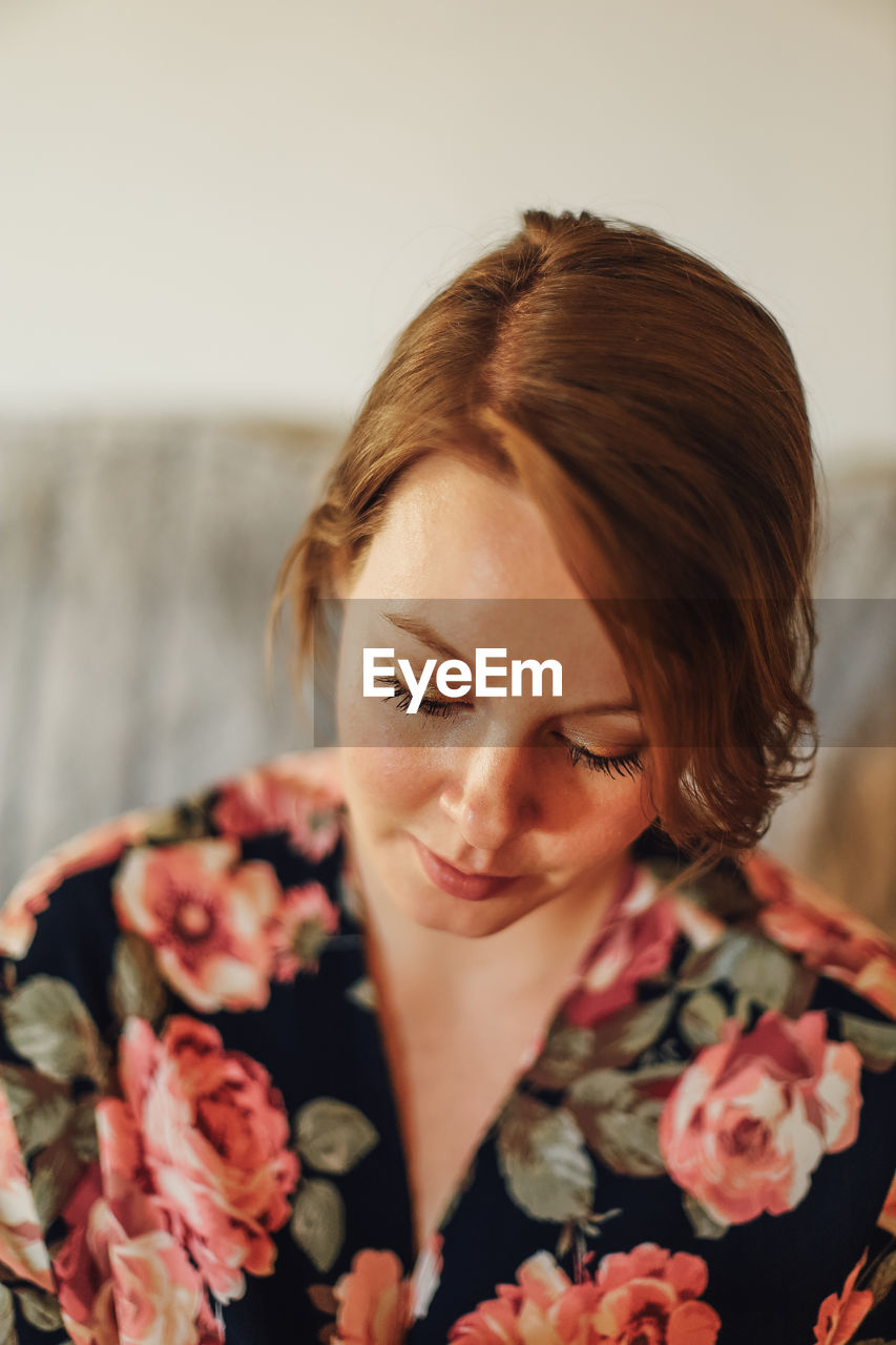 Close-up of young woman looking down