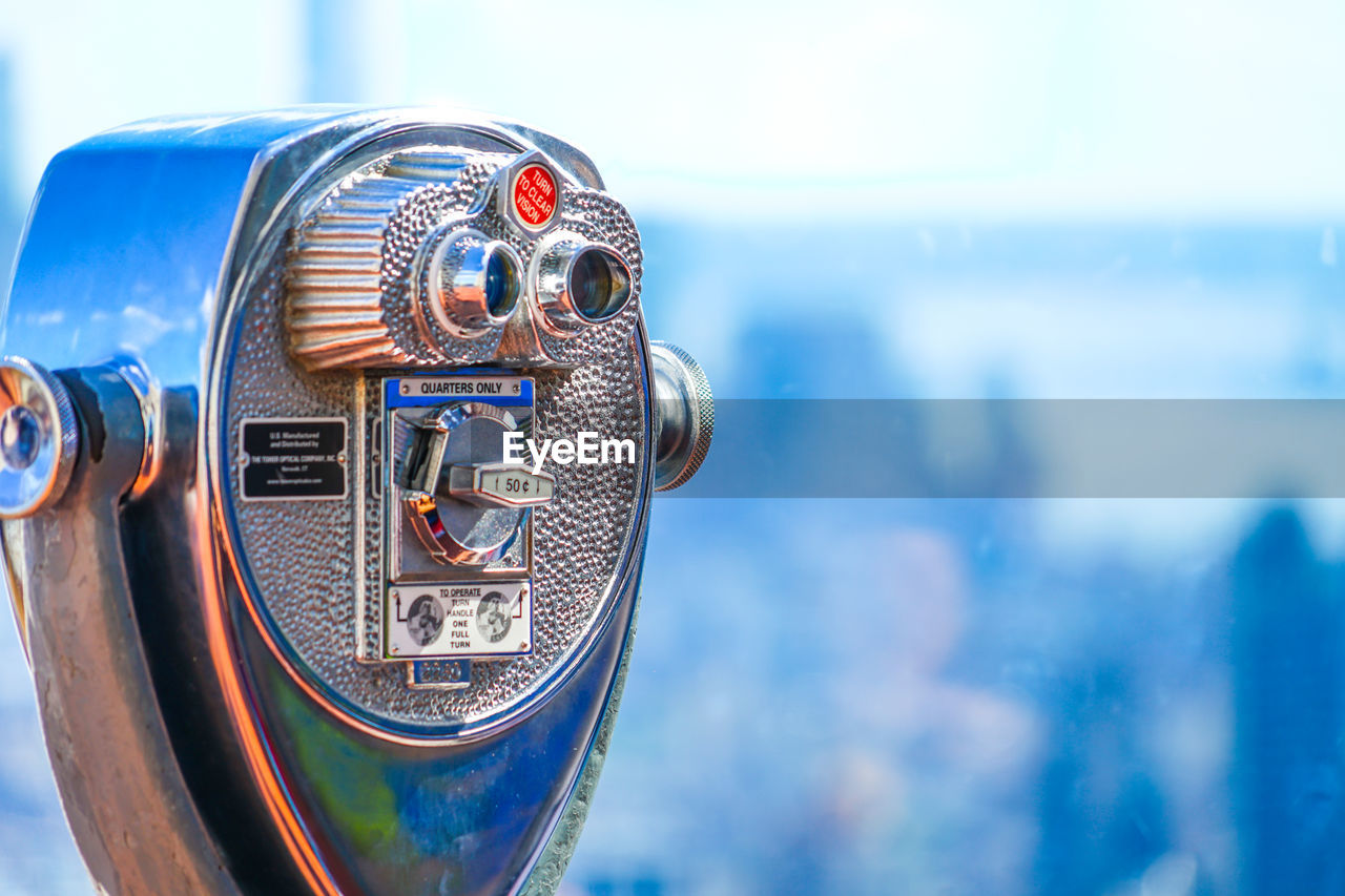 close-up of binoculars against sky