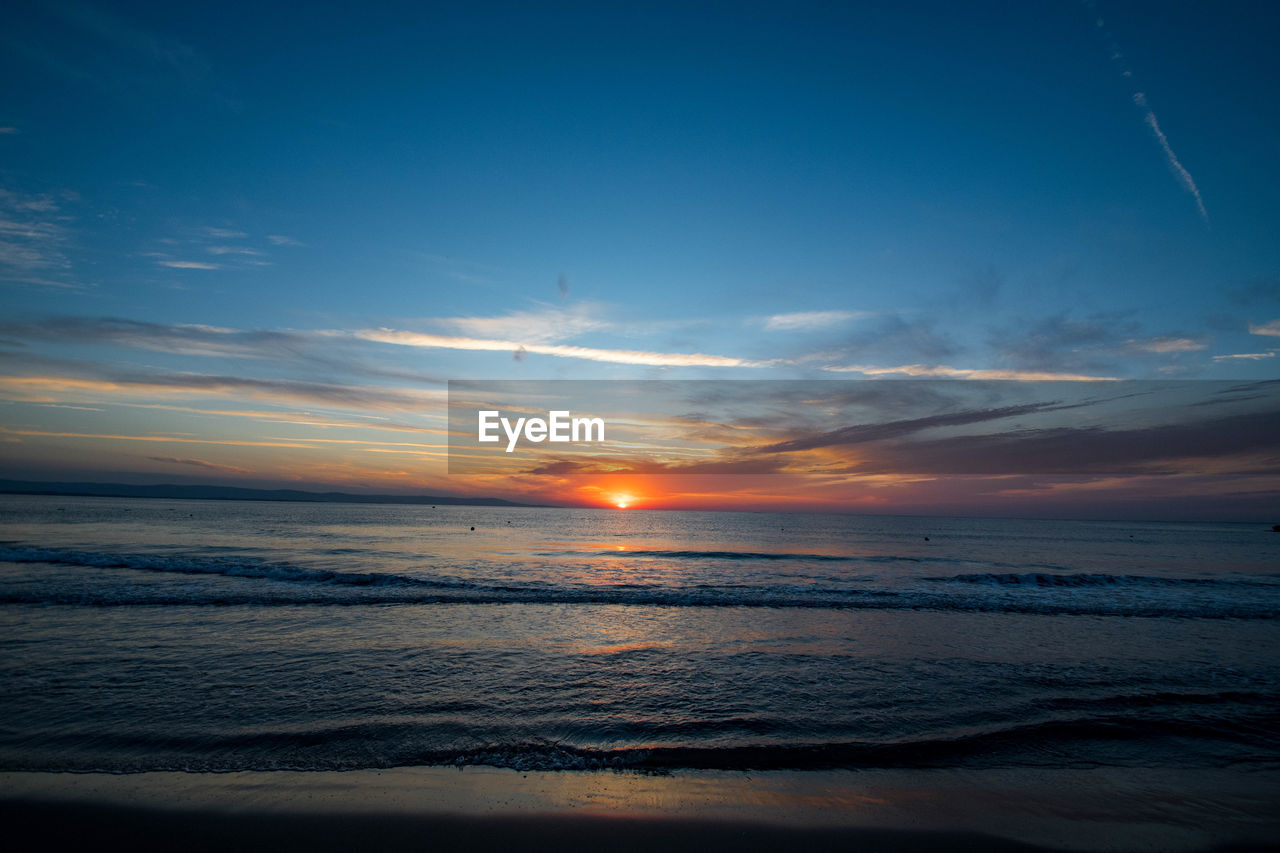 scenic view of sea against sky at sunset
