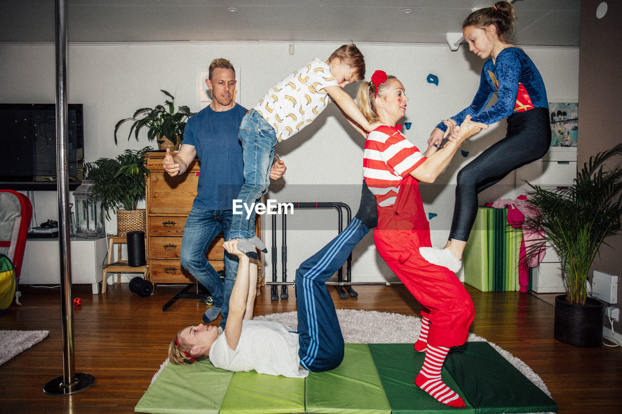 Family practicing balance exercise at home