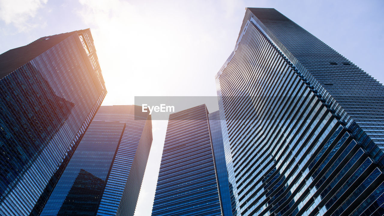 Low angle view of modern buildings against sky