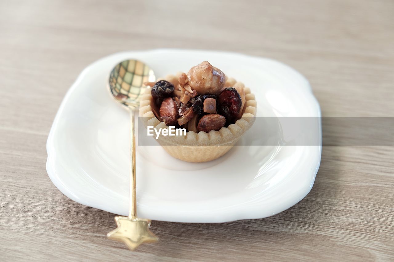 High angle view of tart in plate on table