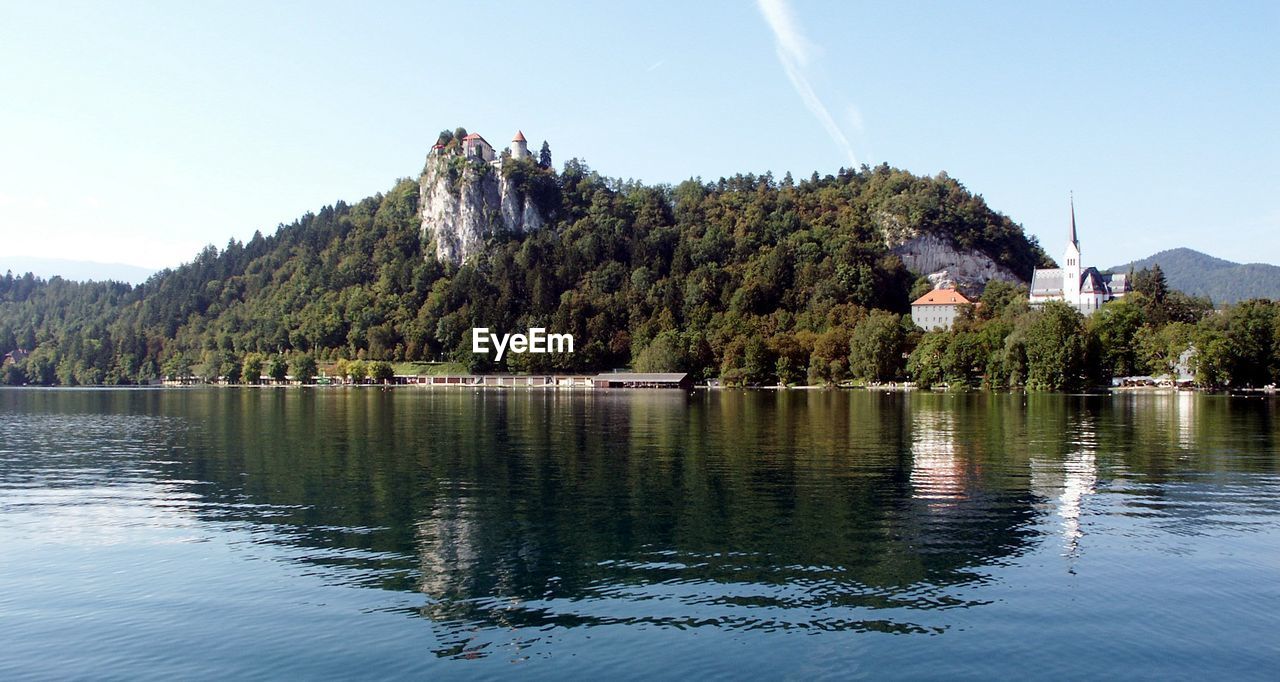 Scenic view of calm lake against sky