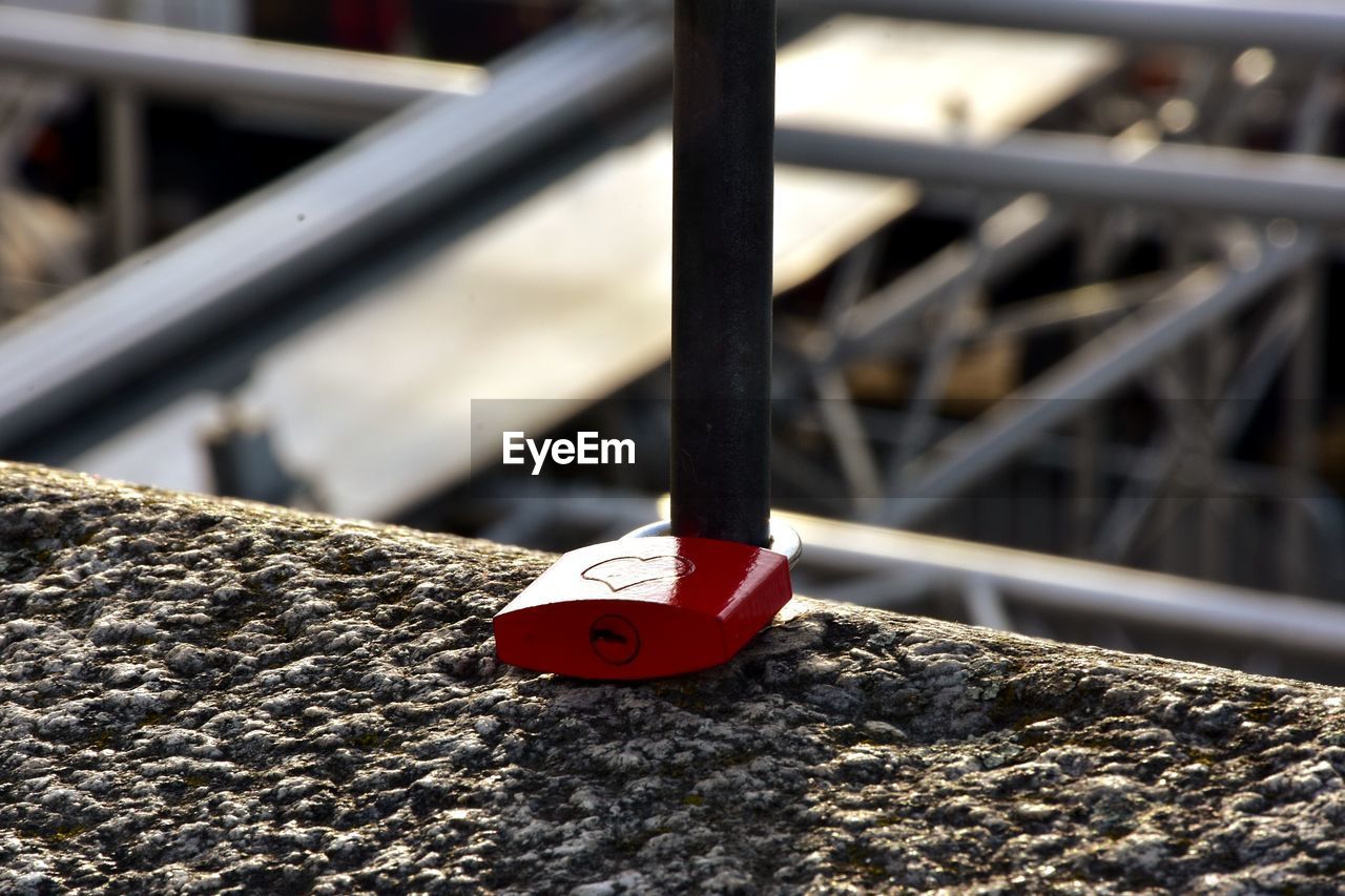 CLOSE UP OF RED BOLLARD