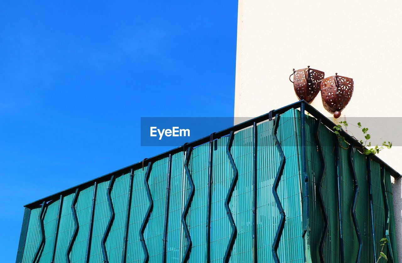 LOW ANGLE VIEW OF HORSE AGAINST BLUE SKY