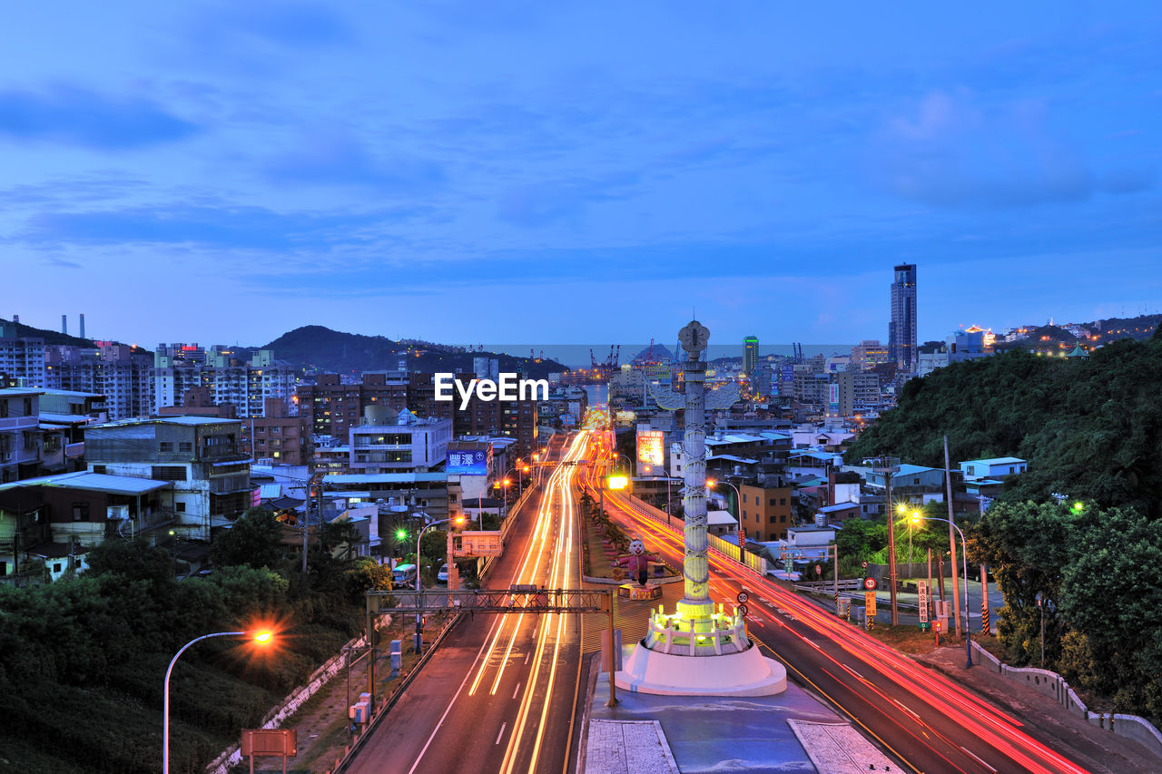 High angle view of light trails on road in city