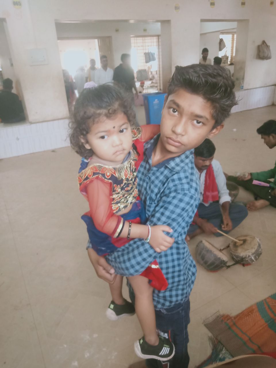 child, childhood, men, full length, female, togetherness, women, family, indoors, baby, standing, toddler, group of people, lifestyles, bonding, adult, portrait, innocence, casual clothing, looking at camera, person, emotion, parent, holding, footwear, cute, small group of people, leisure activity, human face, preschool, looking, domestic life