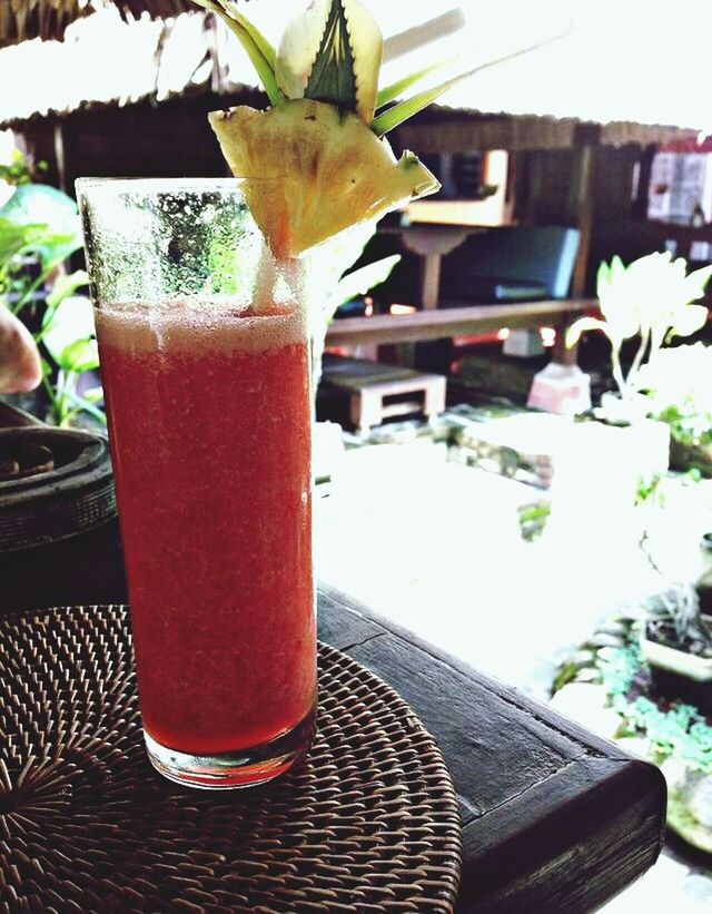 CLOSE-UP OF DRINK ON TABLE