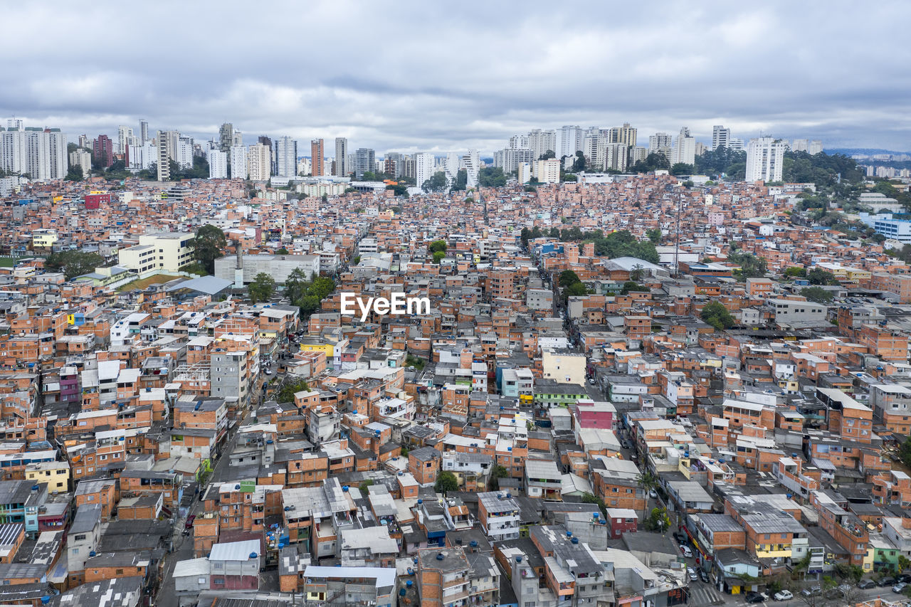 High angle view of city buildings against sky