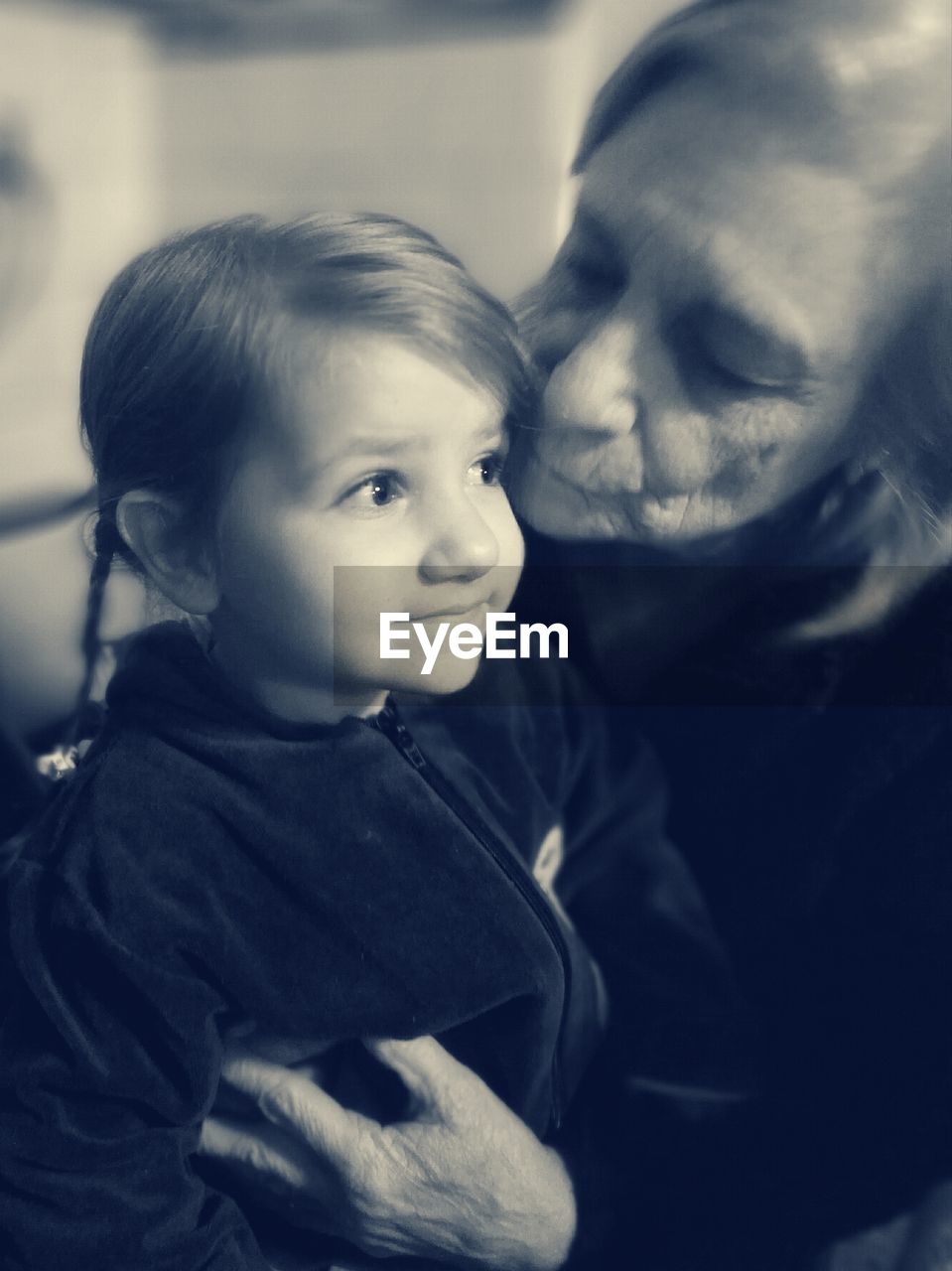Grandmother with granddaughter at home