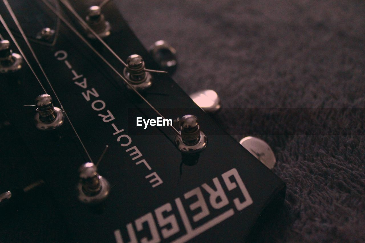 CLOSE-UP OF GUITAR WITH TEXT