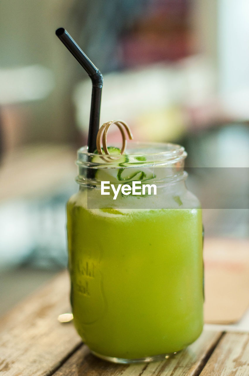 Close-up of drink in jar on table