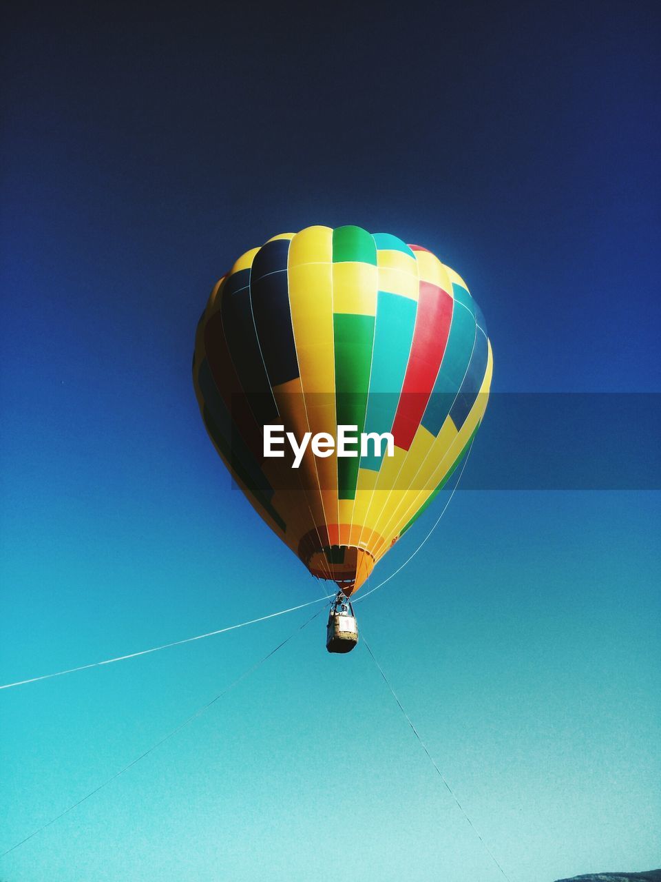 COLORFUL HOT AIR BALLOON FLYING IN SKY