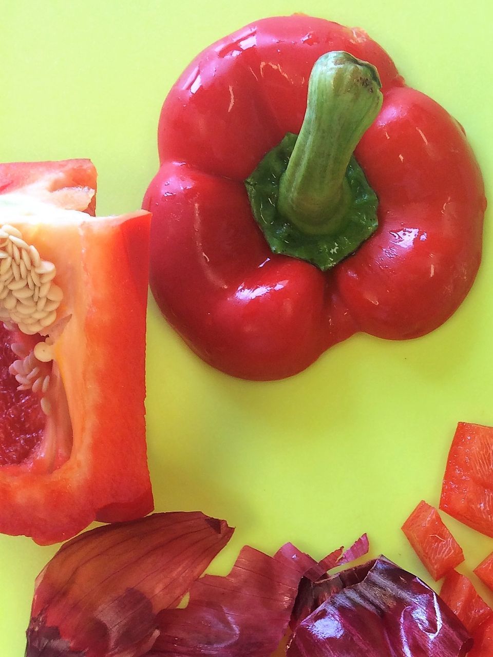 CLOSE-UP OF RED BELL PEPPERS IN CONTAINER