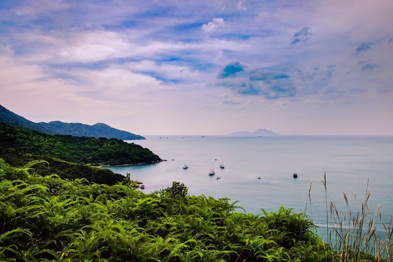 Scenic view of sea against cloudy sky