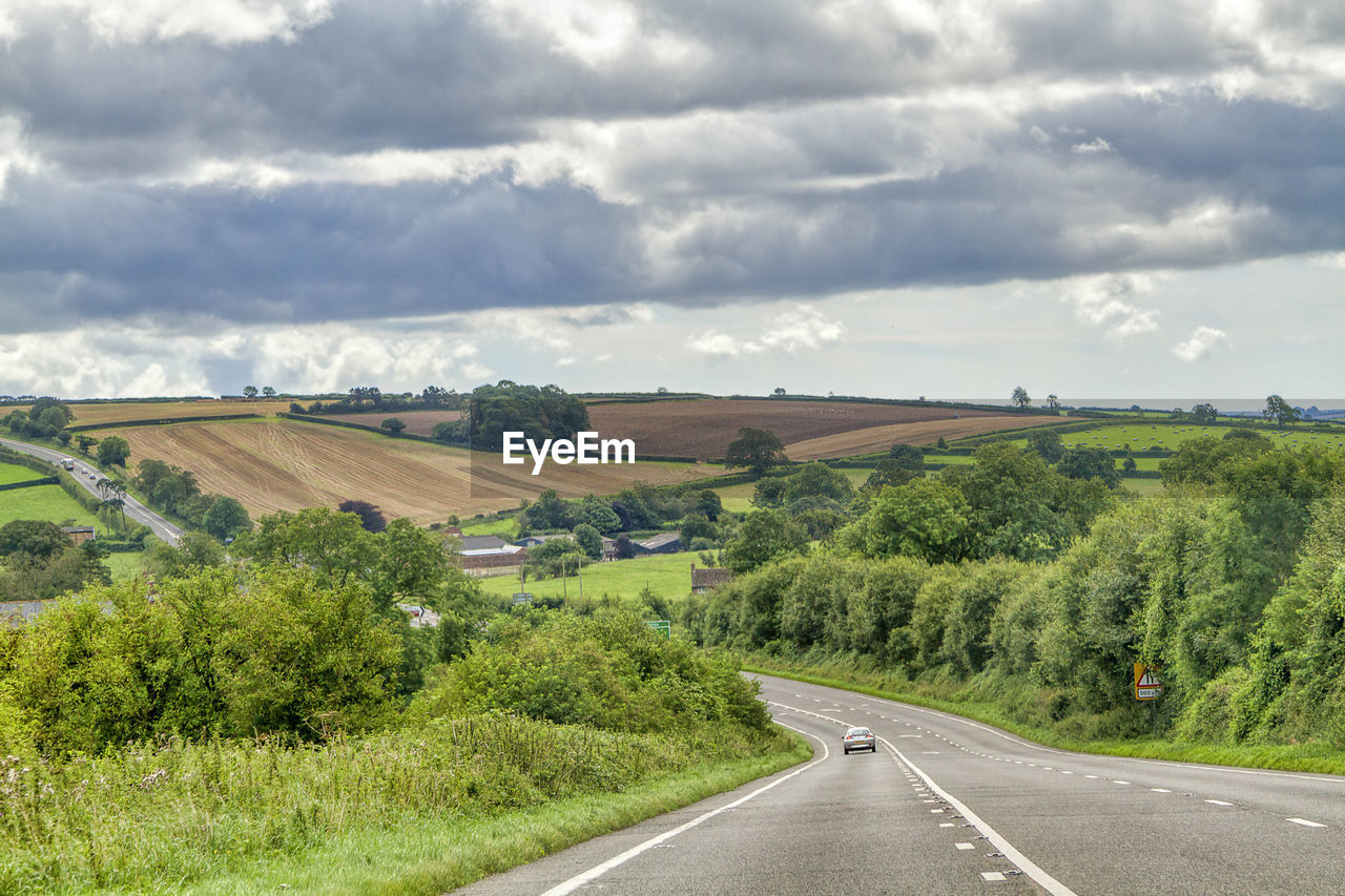 EMPTY ROAD ALONG LANDSCAPE